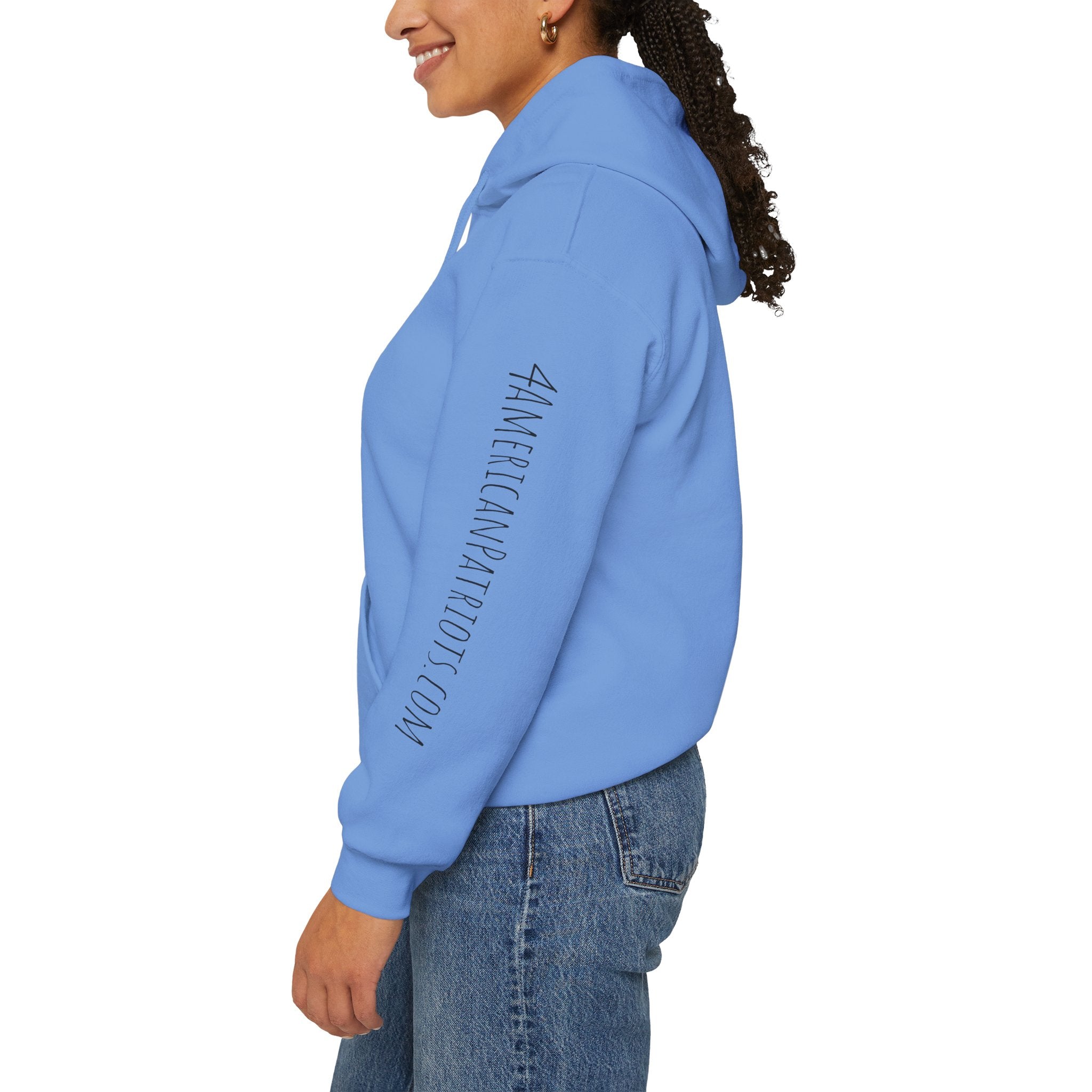 Person wearing a Carolina blue hoodie with text on the sleeve against a white background